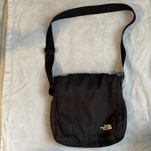 The North Face black messenger bag—used